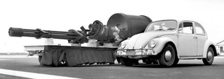The General Electric GAU-8 30mm Gatling gun can fire over 4,000 rounds per minute. Here it is shown with a VW Beetle for scale. (US Air Force)